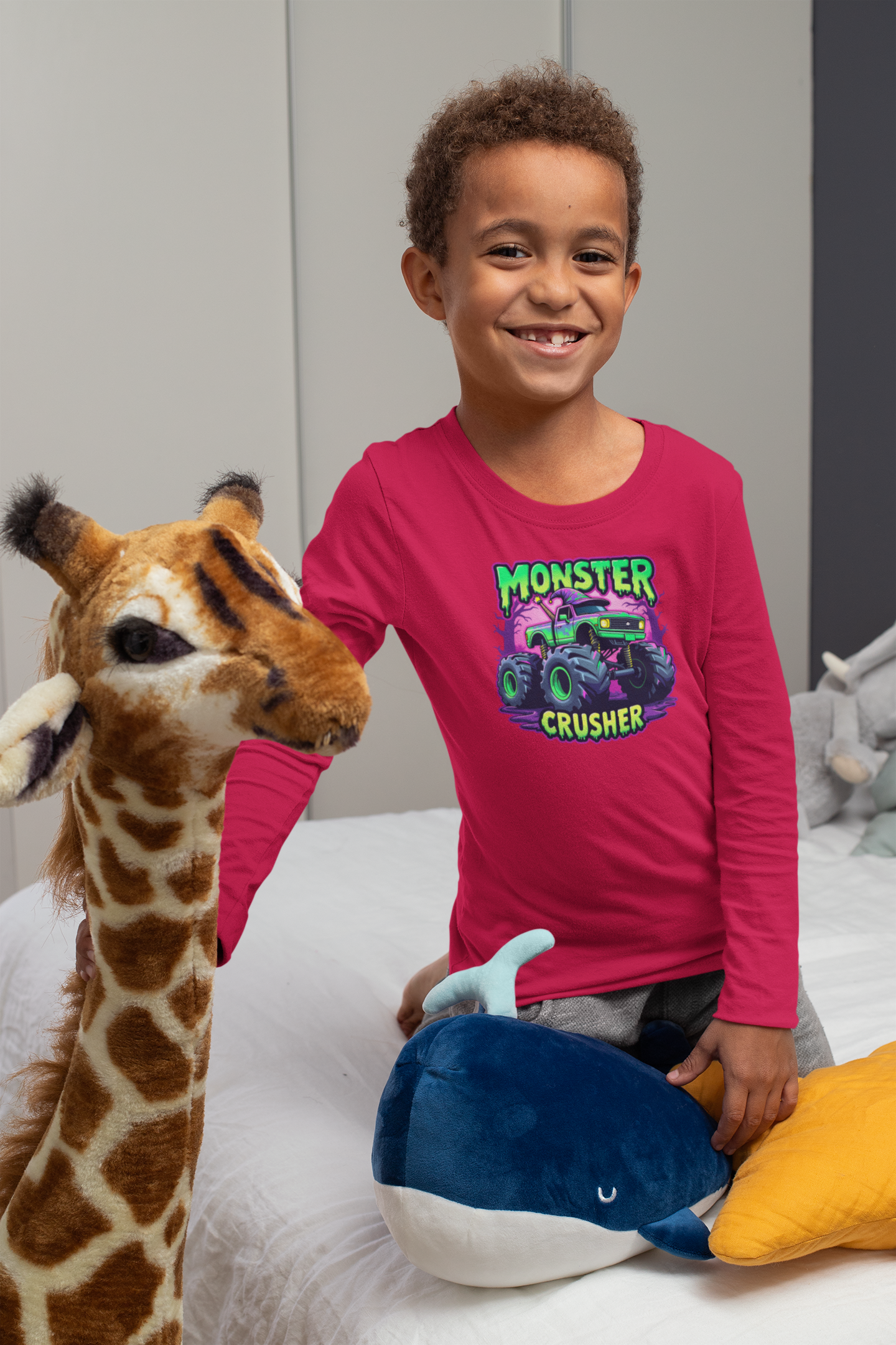 A young boy wearing a t-shirt with a cartoon graphic